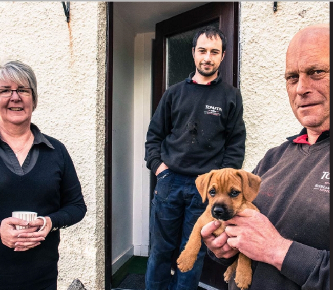 Allan Bartlett, the Tomatin Cooper, and His Family at the Tomatin whisky distillery in the Scottish Highlands