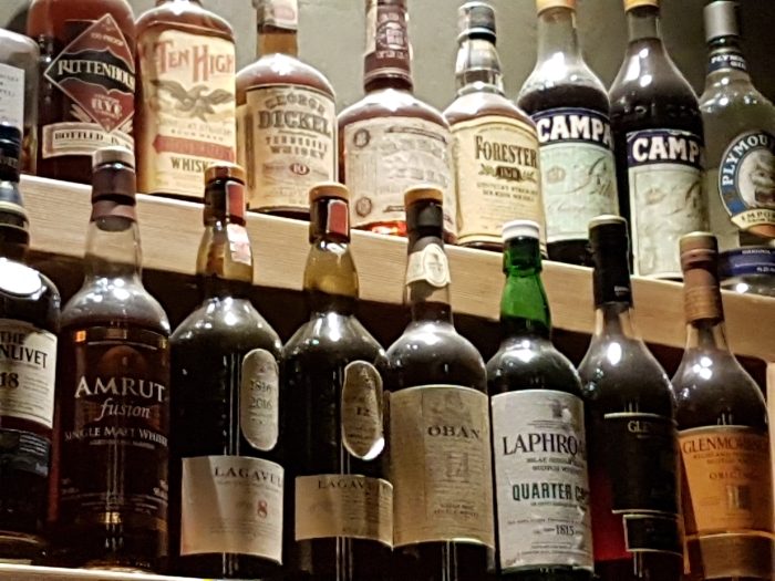 Part of the historic spirits collection at the Clumsies bar in Athens