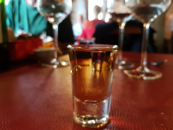 Glass of natural peket at The Maison du Peket Restaurant, also known as the Amon Nanesse Restaurant, in Liege, Belgium
