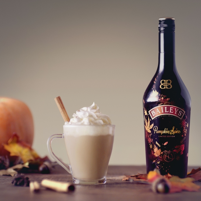 Baileys Pumpkin Spice Bottle and glass of Baileys chai cocktail