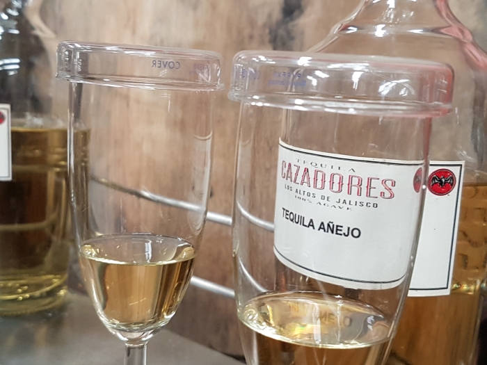 Tasting tequila while touring the Cazadores tequila distillery in Jalisco, Mexico.