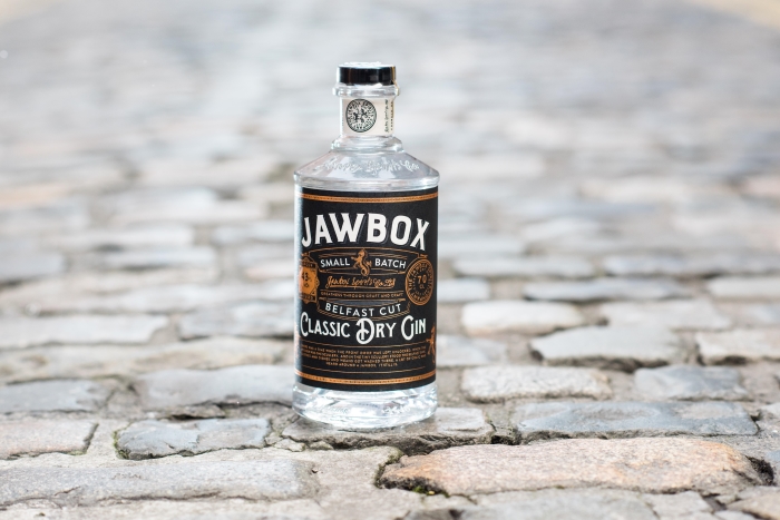 A bottle of Jawbox Gin on cobblestones in Belfast, Northern Ireland