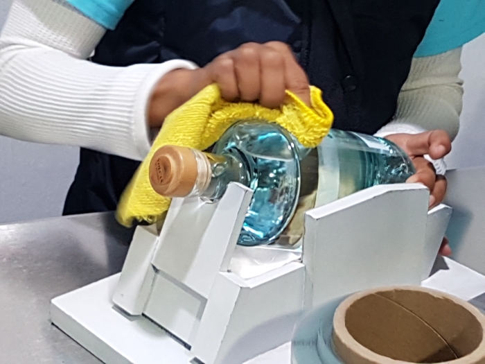 Polishing a bottle at the Volcan de mi Tierra tequila distillery in Jalsico in Mexico