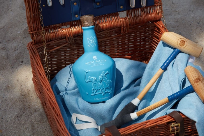 Royal Salute whisky bottle with polo mallets