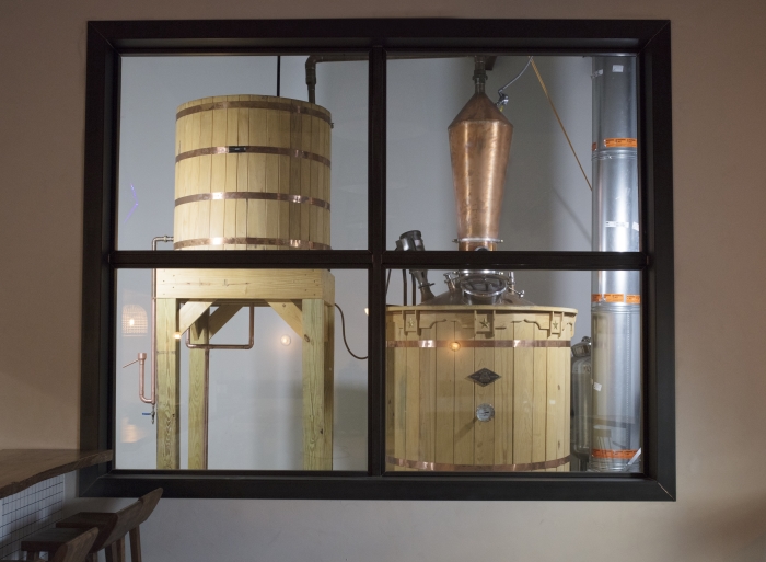 Wooden fermentation vats and still at the Desert Door Texas Sotol Distillery