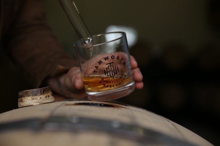 Barrel-tapping at Tamworth Distilling in New Hampshire