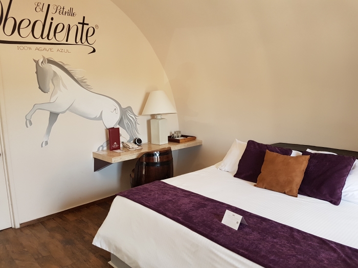 A Tequila Barrel Hotel Bedroom at Casa Nobles on a distillery tour