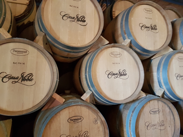 Tequila barrels on a Casa Nobles tequila distillery tour