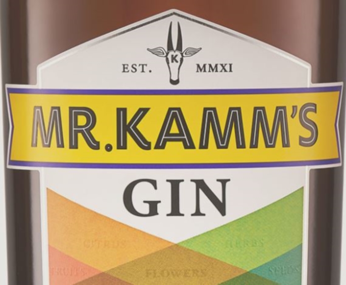 The label of a bottle of Mr Kamm's Gin being reviewed by Travel Distilled.