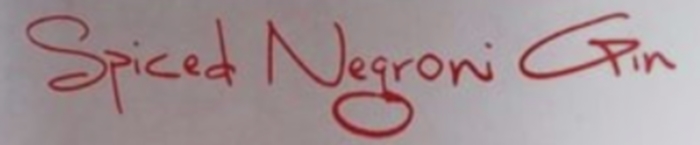 Detail from the label of Four Pillars Spiced Negroni Gin, showing the name.