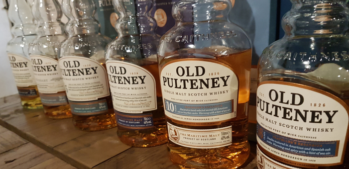 A row of Old Pulteney Scottish whisky bottles