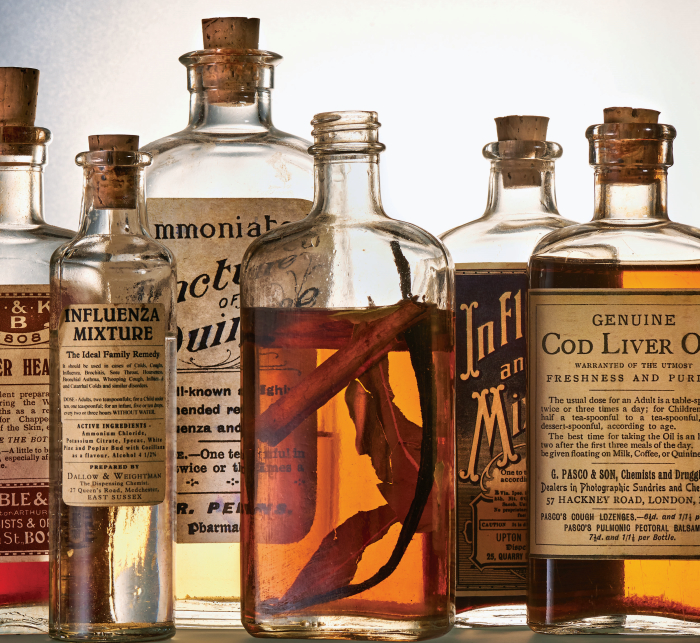 Old whiskey bottles from The Curious Bartender's Whiskey Road Trip