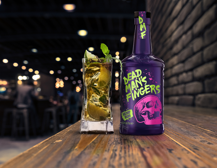A bottle of Dead Man's Fingers CBD-infused Hemp Rum with a rum cocktail