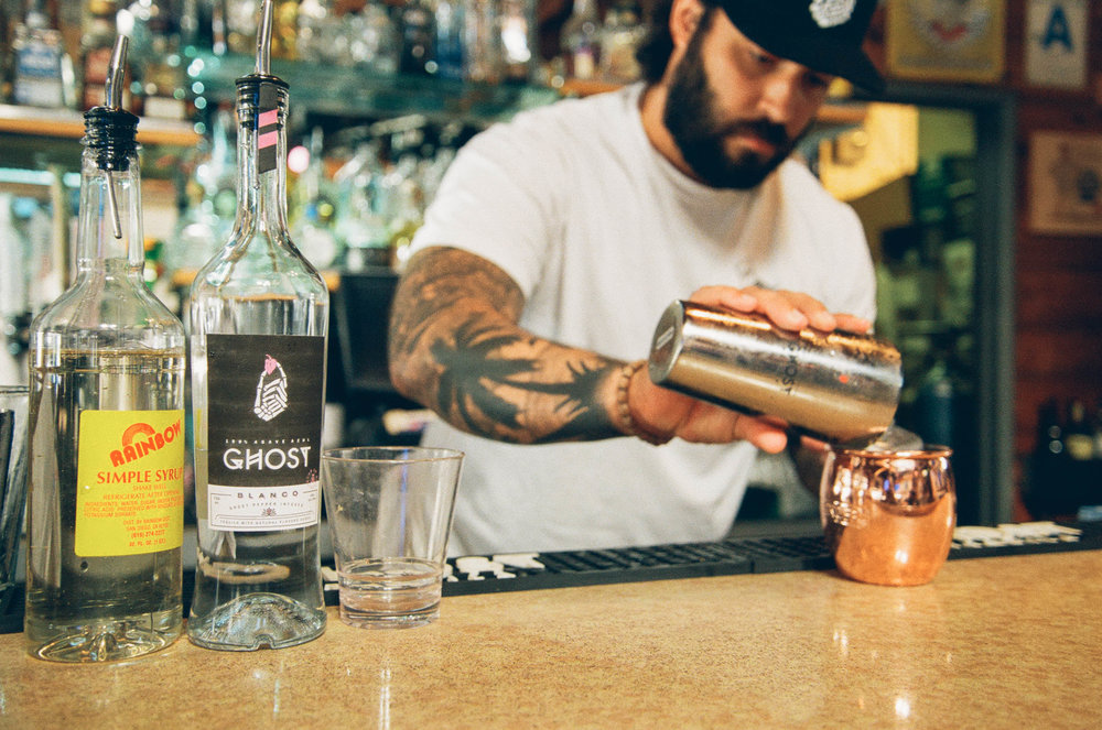 Bartender making a Ghost tequila cocktail
