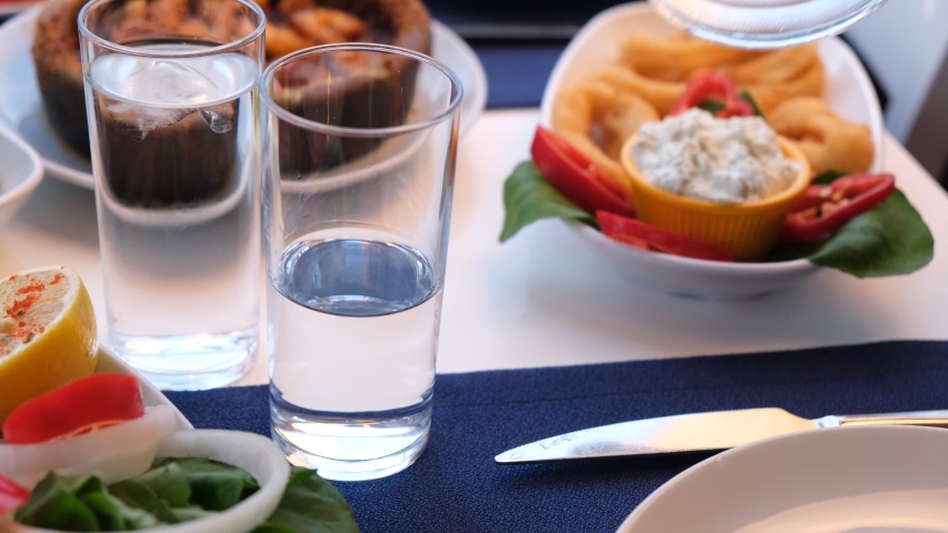 Glass of ouzo with a glass of water