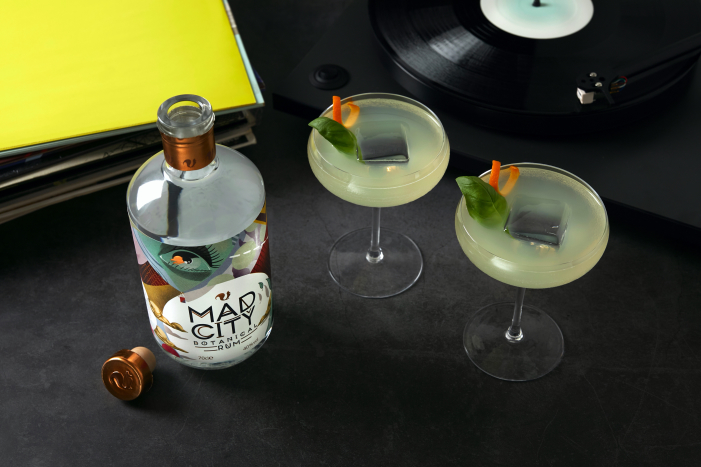 Rum cocktails and a Bottle of Mad City Botanical Rum