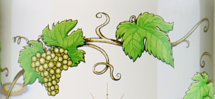 Detail from the label of a bottle of Pisco Waqar from Chile and made from Muscat grapes