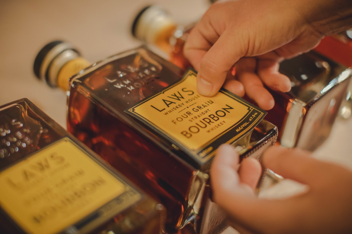 Laws Whiskey House Labeling Bottle